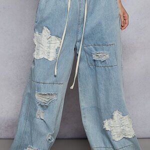 POLJ23 Designed in jogger pants in textured denim with distress and crochet